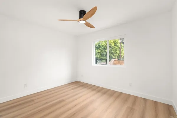 a view of a balcony with wooden floor