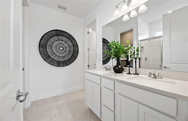 a bathroom with a sink a mirror and a toilet