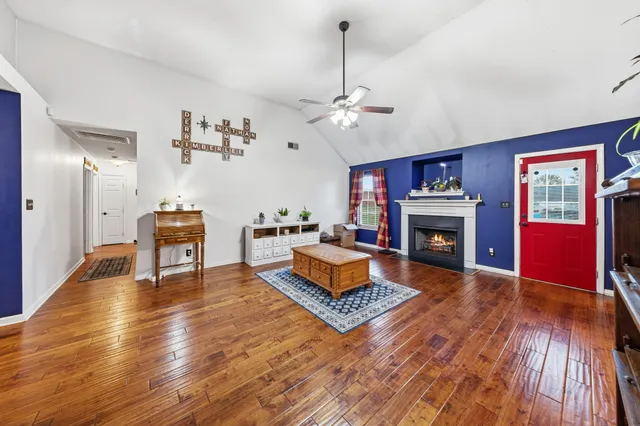 a living room with furniture and a fireplace