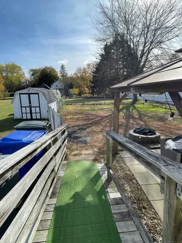 a view of a balcony with two chairs and a table