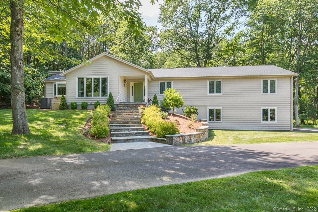 12 Birch Road Woodbridge, CT 06525 - Photo 1 of 1 a front view of house with yard and green space