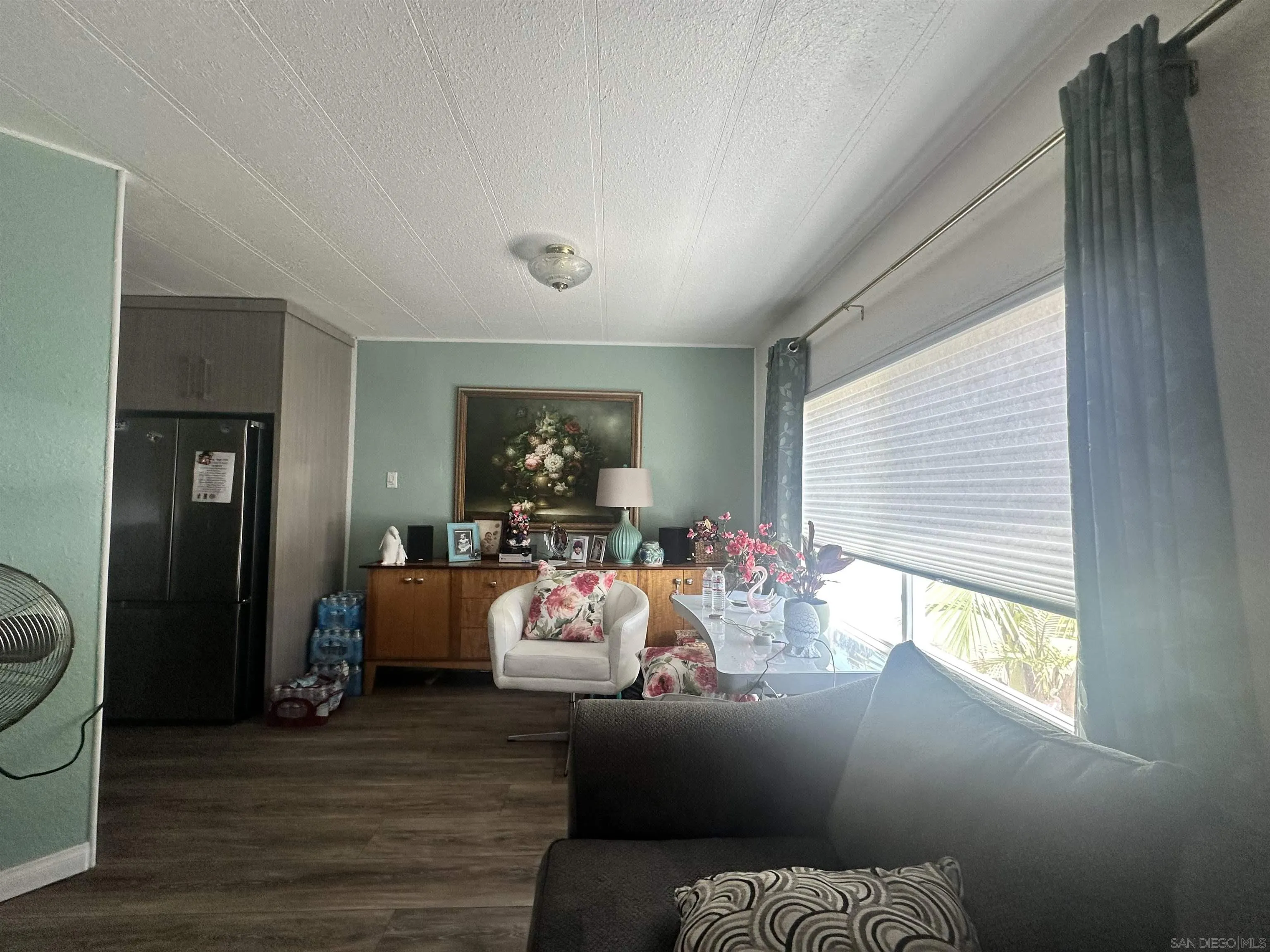 275 South Worthington Street, Unit SPC 112 Spring Valley, CA 91977 - Photo 2 of 9 a living room with furniture and a window