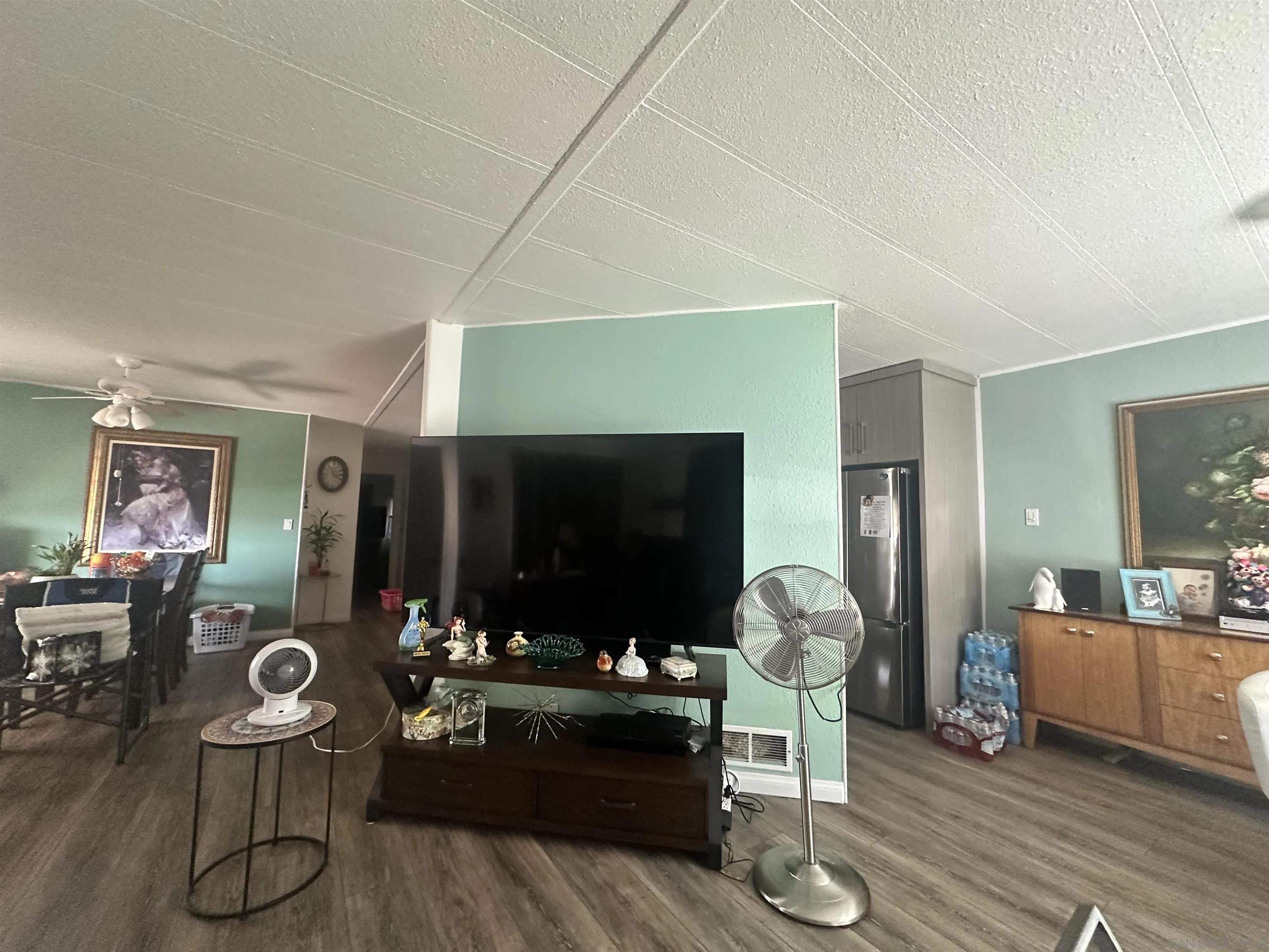 275 South Worthington Street, Unit SPC 112 Spring Valley, CA 91977 - Photo 3 of 9 a living room with furniture and a flat screen tv