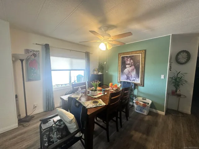 a dining room with furniture and window