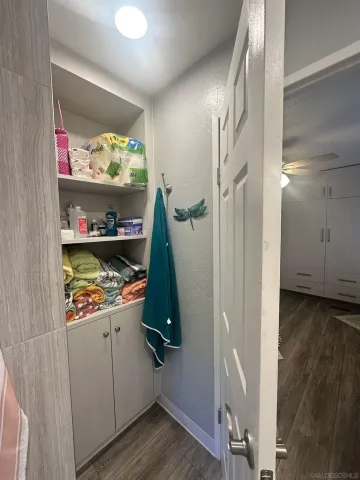 a view of cabinets and wooden floor