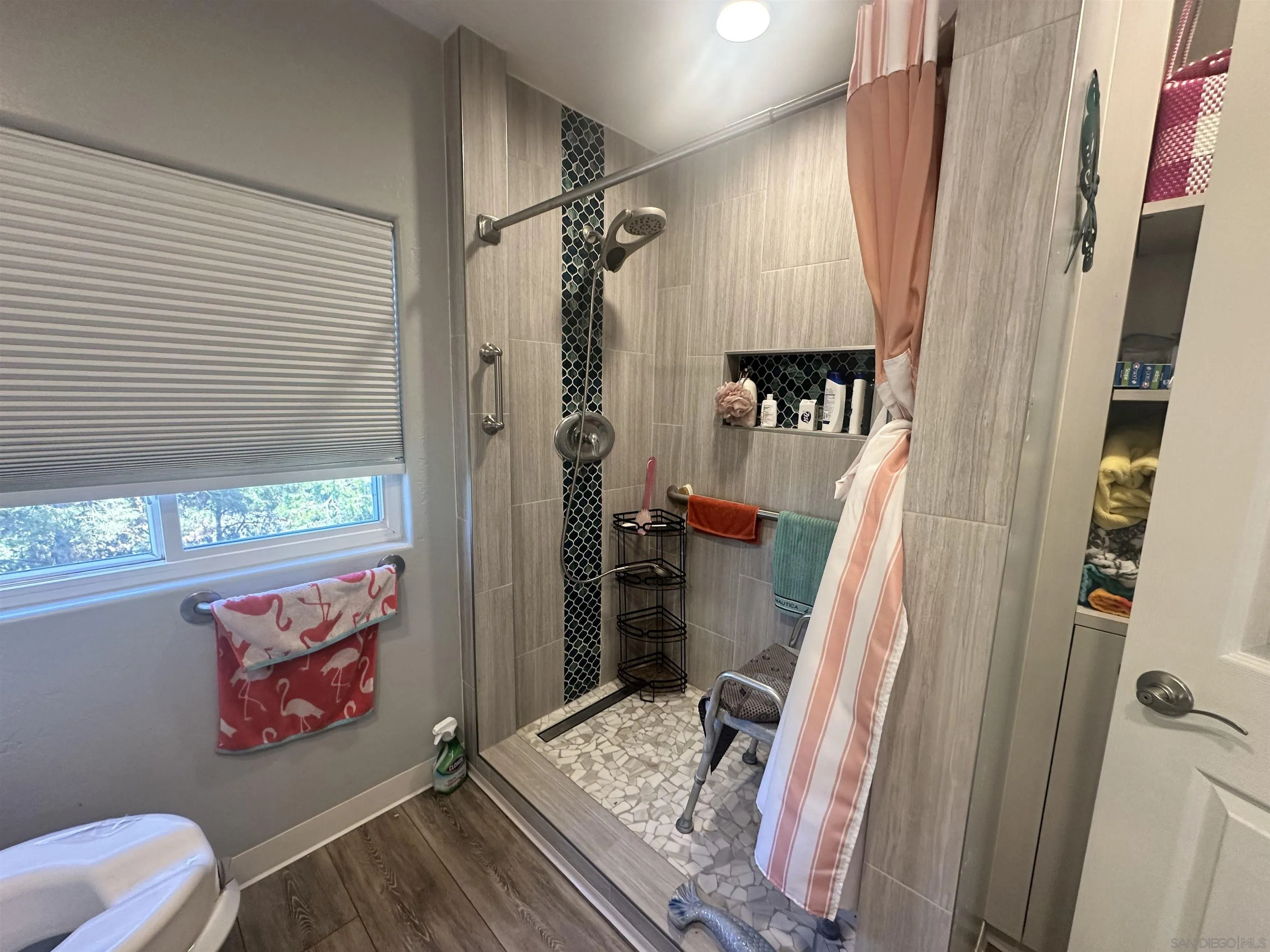 275 South Worthington Street, Unit SPC 112 Spring Valley, CA 91977 - Photo 8 of 9 a bathroom with a sink toilet and shower