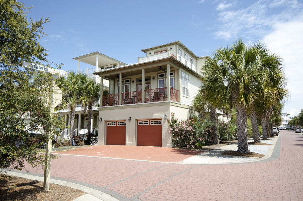 157 East Cobia Run Inlet Beach Inlet Beach, FL 32461 - Photo 2 of 27 a front view of a house with a yard and garage