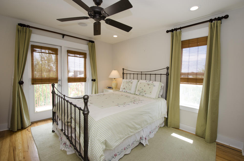 157 East Cobia Run Inlet Beach Inlet Beach, FL 32461 - Photo 21 of 27 a bedroom with a bed and a chandelier