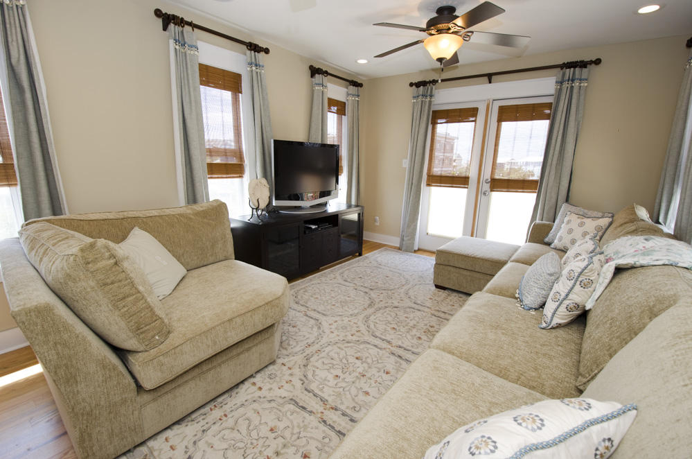 157 East Cobia Run Inlet Beach Inlet Beach, FL 32461 - Photo 24 of 27 a living room with furniture a flat screen tv and a large window