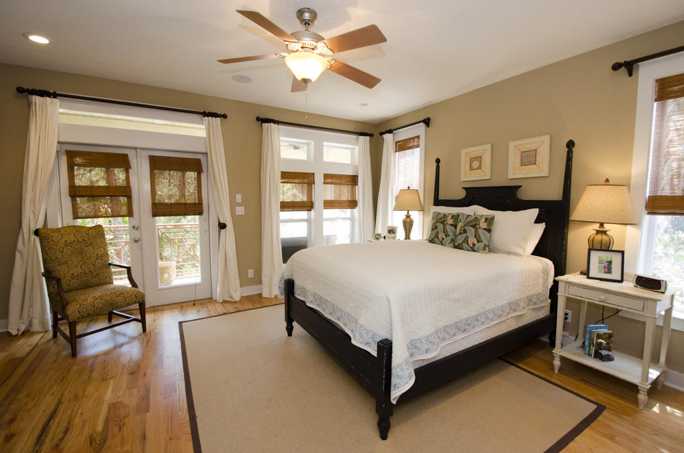 157 East Cobia Run Inlet Beach Inlet Beach, FL 32461 - Photo 9 of 27 a bedroom with a bed chairs and wooden floor