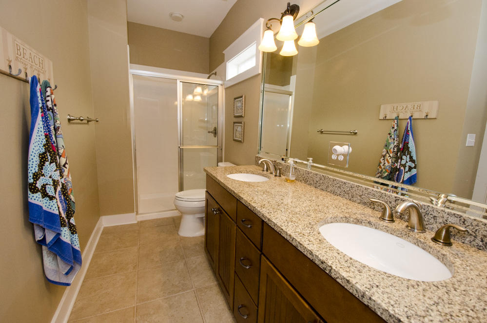 157 East Cobia Run Inlet Beach Inlet Beach, FL 32461 - Photo 10 of 27 a bathroom with a granite countertop sink a toilet and shower