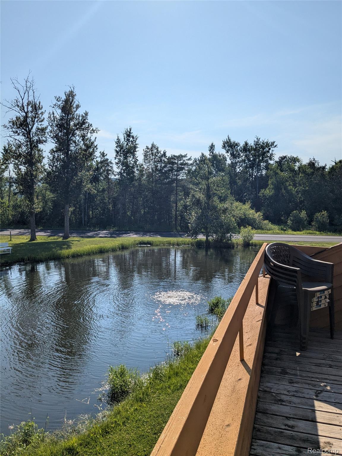 4749 South Pleasantview Road, Unit 20 Harbor Springs, MI 49740 - Photo 16 of 44 View of the Community Pond from Main Level Deck