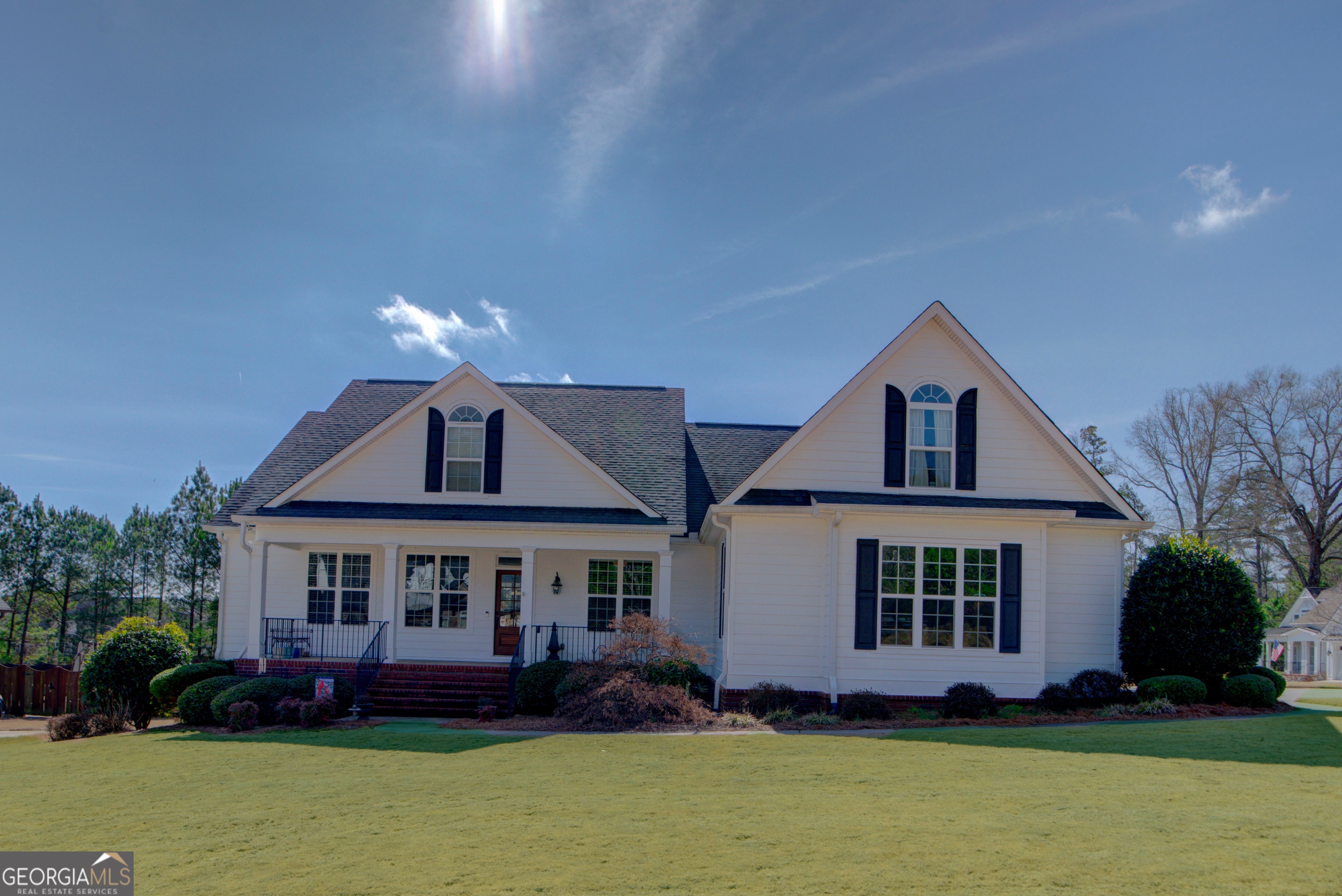 a front view of a house with garden