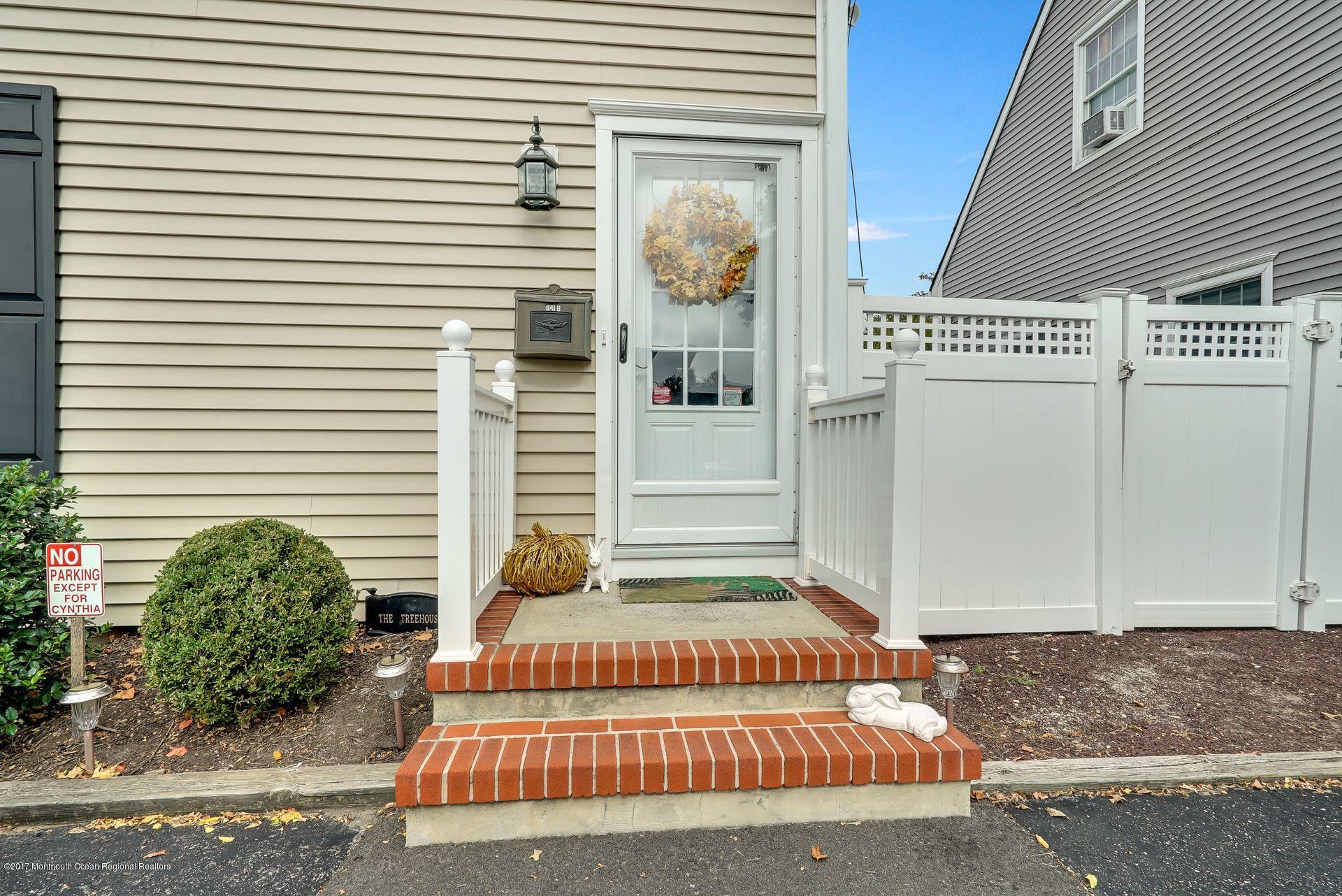 Union Avenue, Unit B Brielle, NJ 08730 - Photo 14 of 28 a front view of a house with a garage