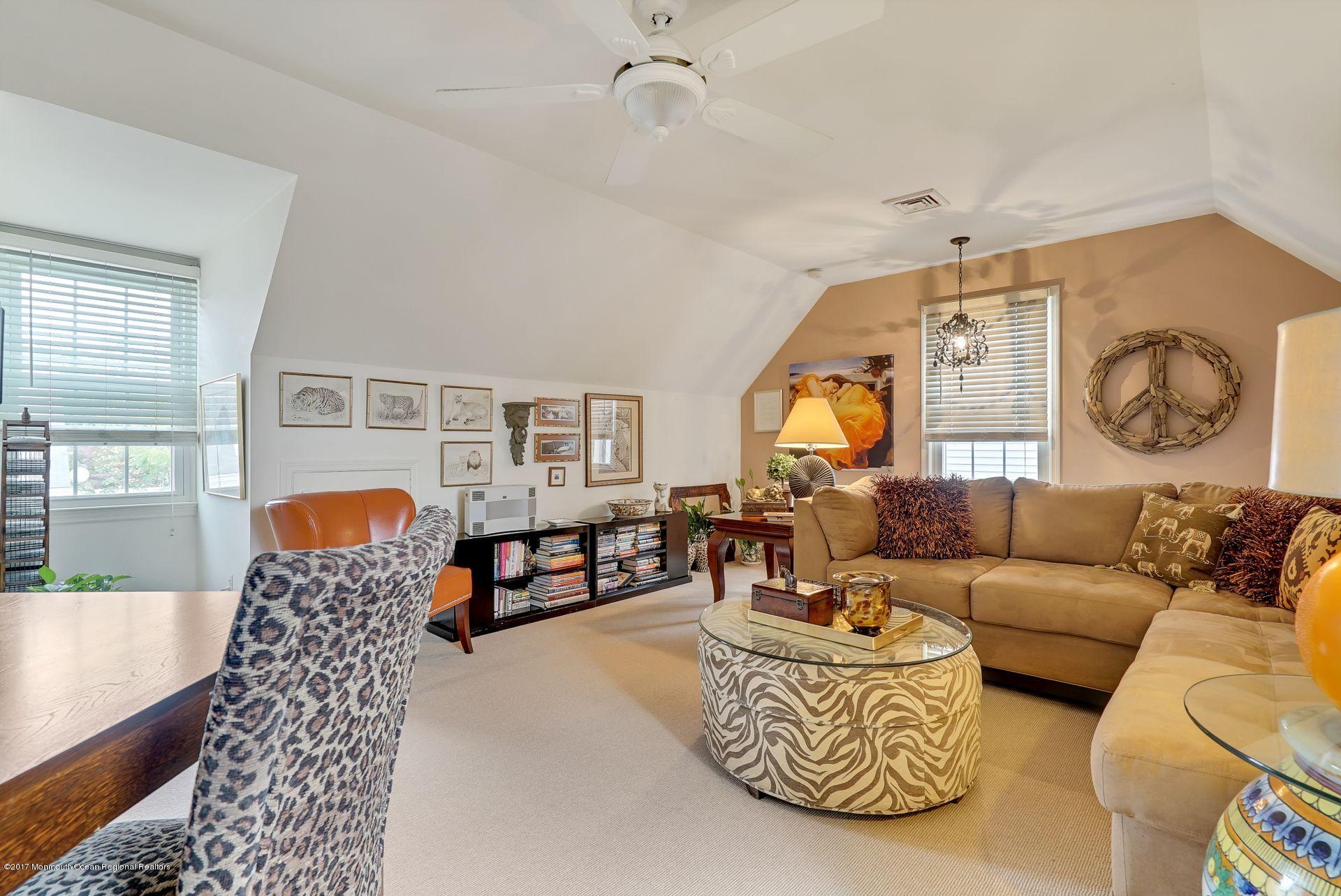 Union Avenue, Unit B Brielle, NJ 08730 - Photo 19 of 28 a living room with furniture a rug and a window