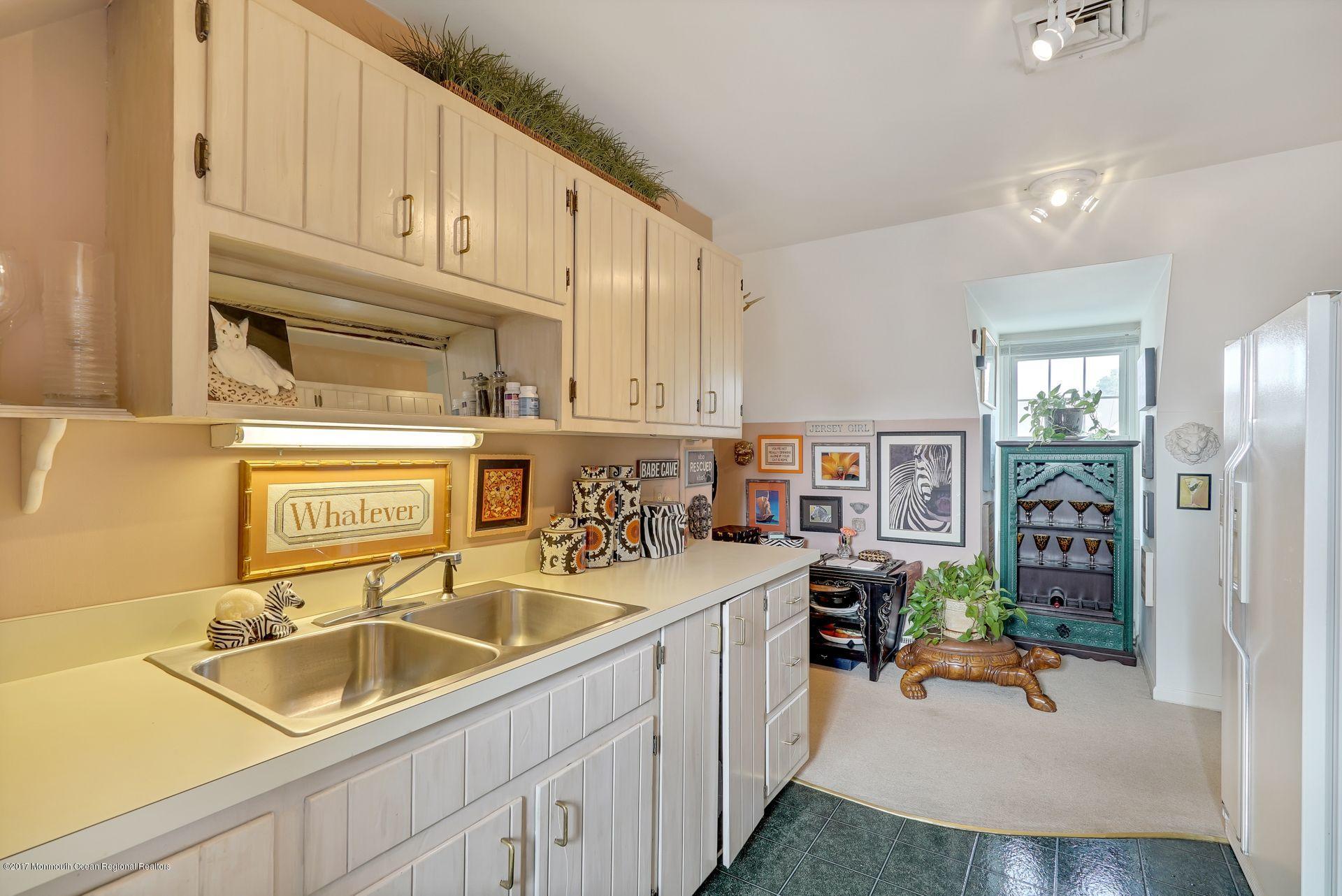 Union Avenue, Unit B Brielle, NJ 08730 - Photo 22 of 28 a kitchen filled a sink a counter and appliances