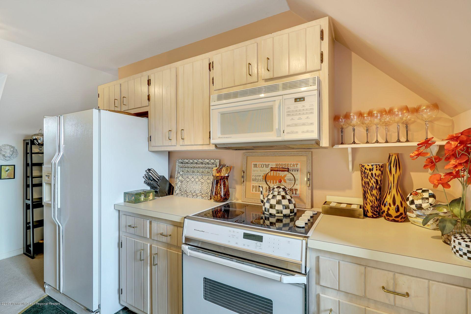 Union Avenue, Unit B Brielle, NJ 08730 - Photo 23 of 28 a kitchen with stainless steel appliances white cabinets and a refrigerator