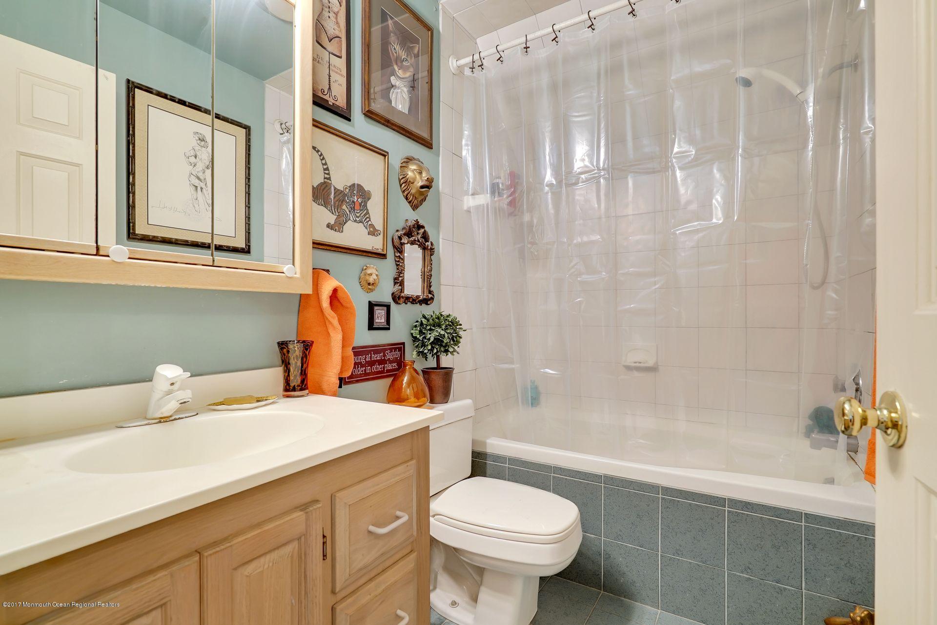 Union Avenue, Unit B Brielle, NJ 08730 - Photo 24 of 28 a bathroom with a sink toilet vanity and shower