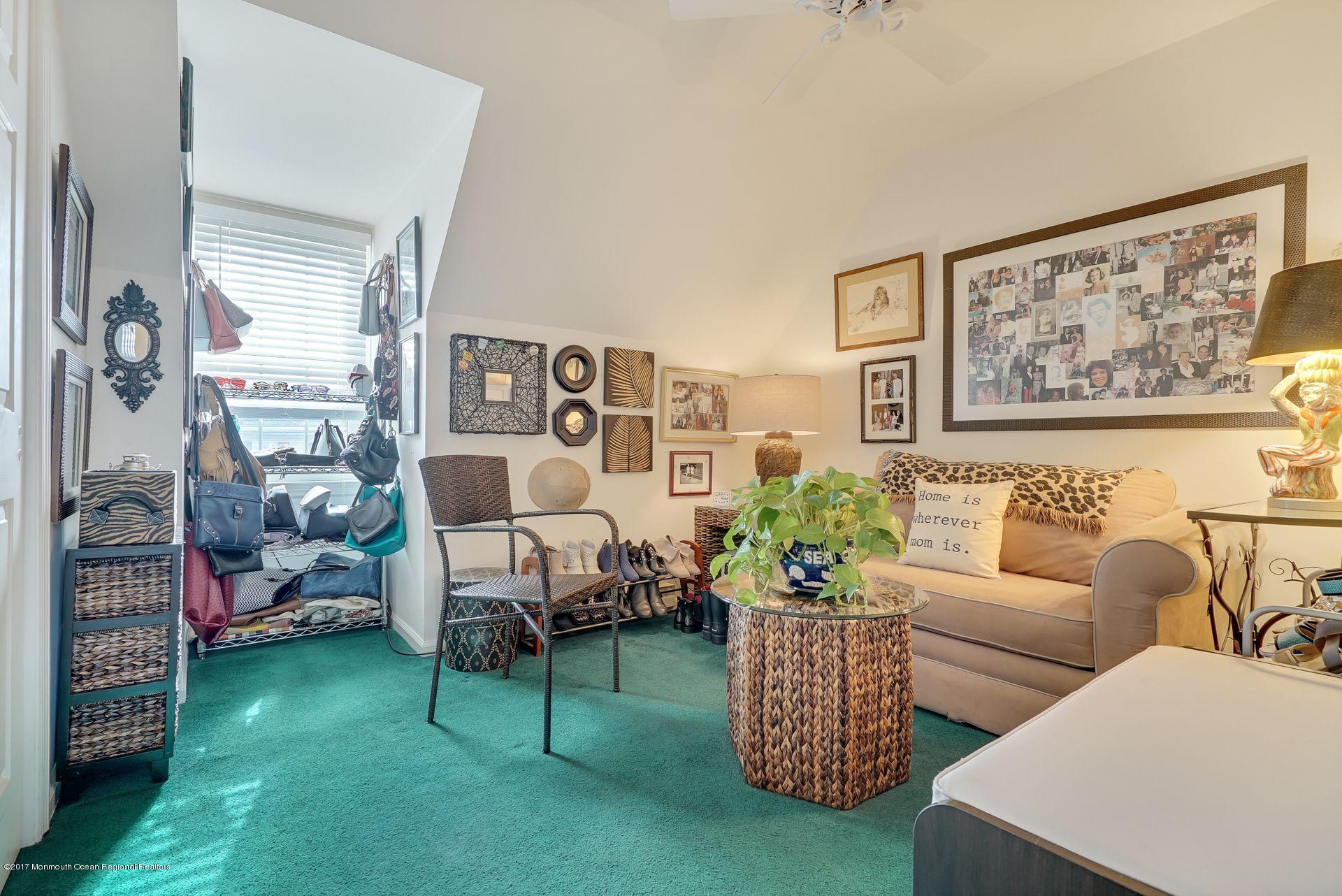 Union Avenue, Unit B Brielle, NJ 08730 - Photo 25 of 28 a living room with furniture and a potted plant