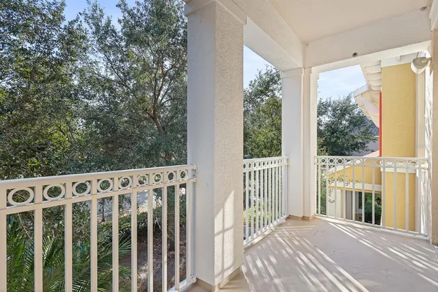 a view of a wooden fence with trees