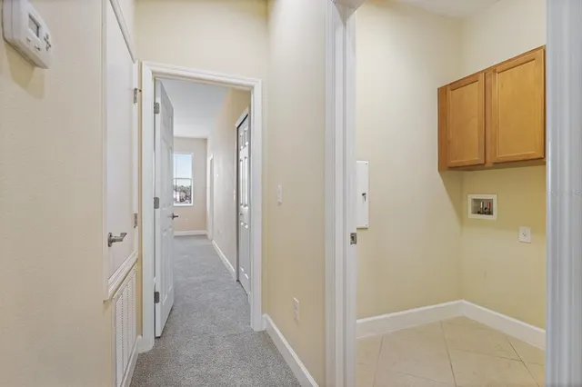 a view of a bathroom from a hallway