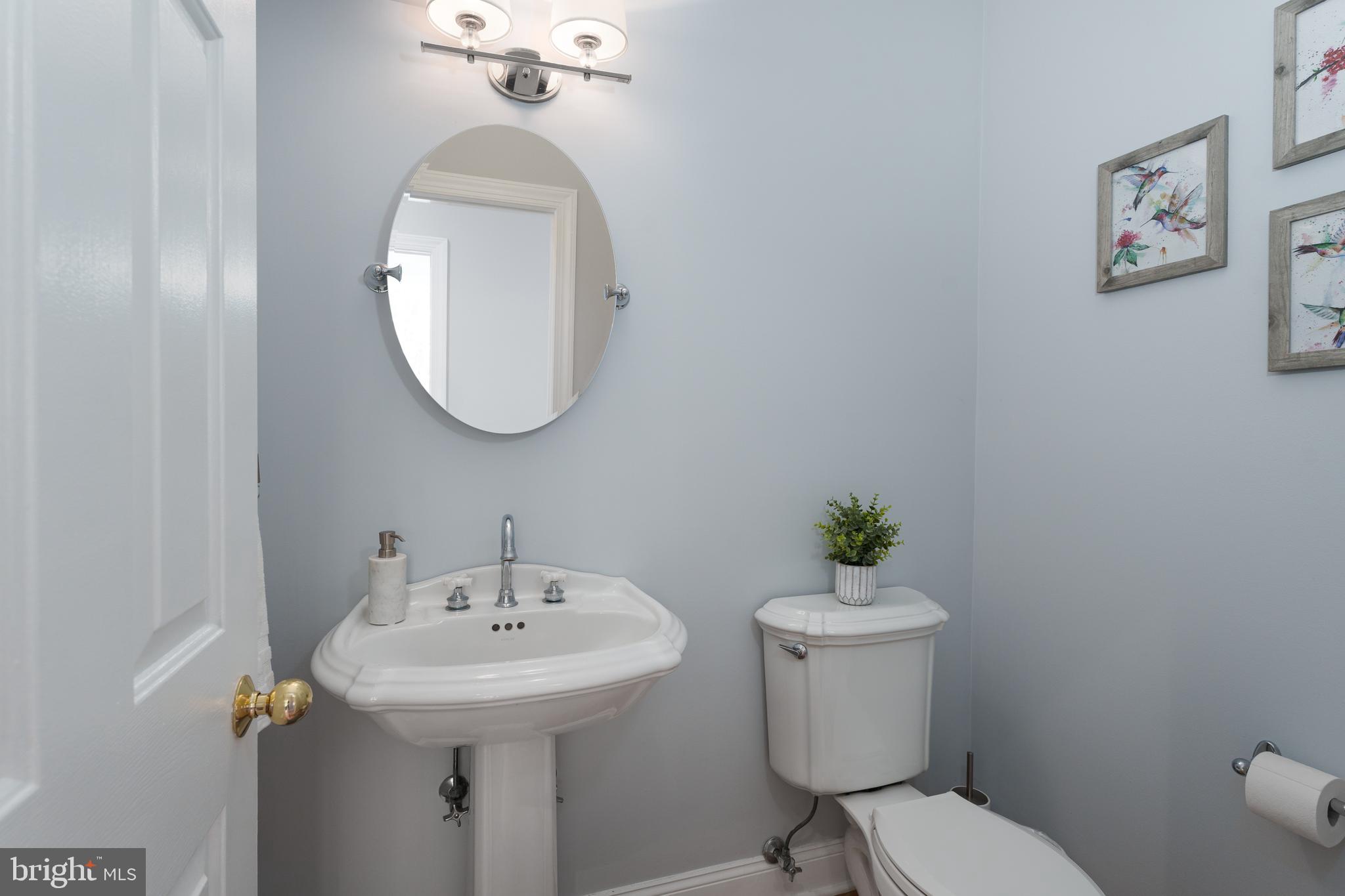 9 Deer Path Skillman, NJ 08558 - Photo 17 of 48 a bathroom with a toilet a sink and mirror