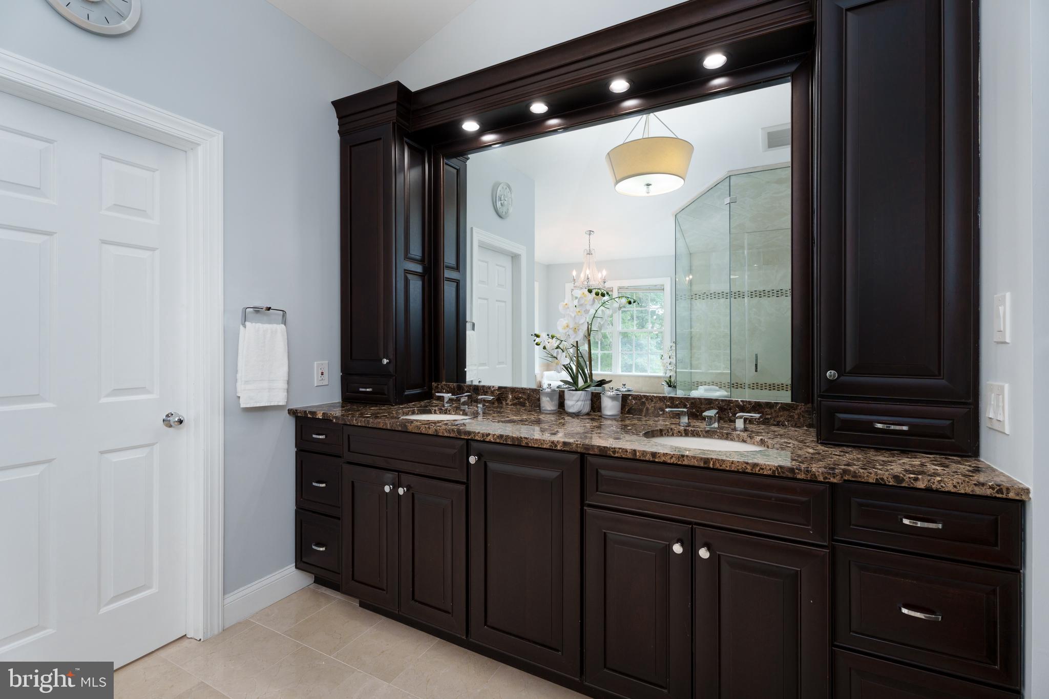 9 Deer Path Skillman, NJ 08558 - Photo 21 of 48 a bathroom with double vanity and a mirror