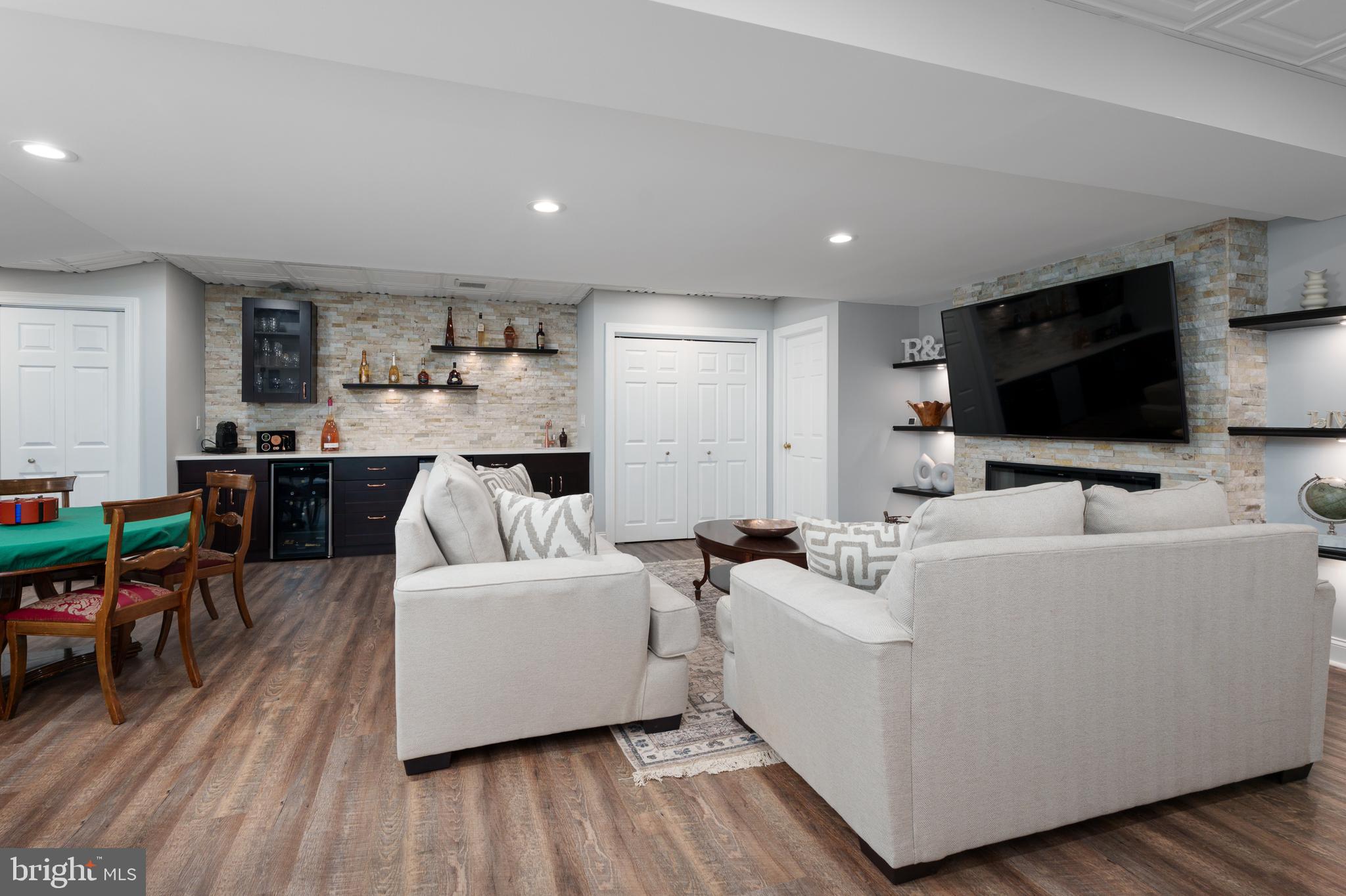 9 Deer Path Skillman, NJ 08558 - Photo 27 of 48 a living room with furniture and a flat screen tv