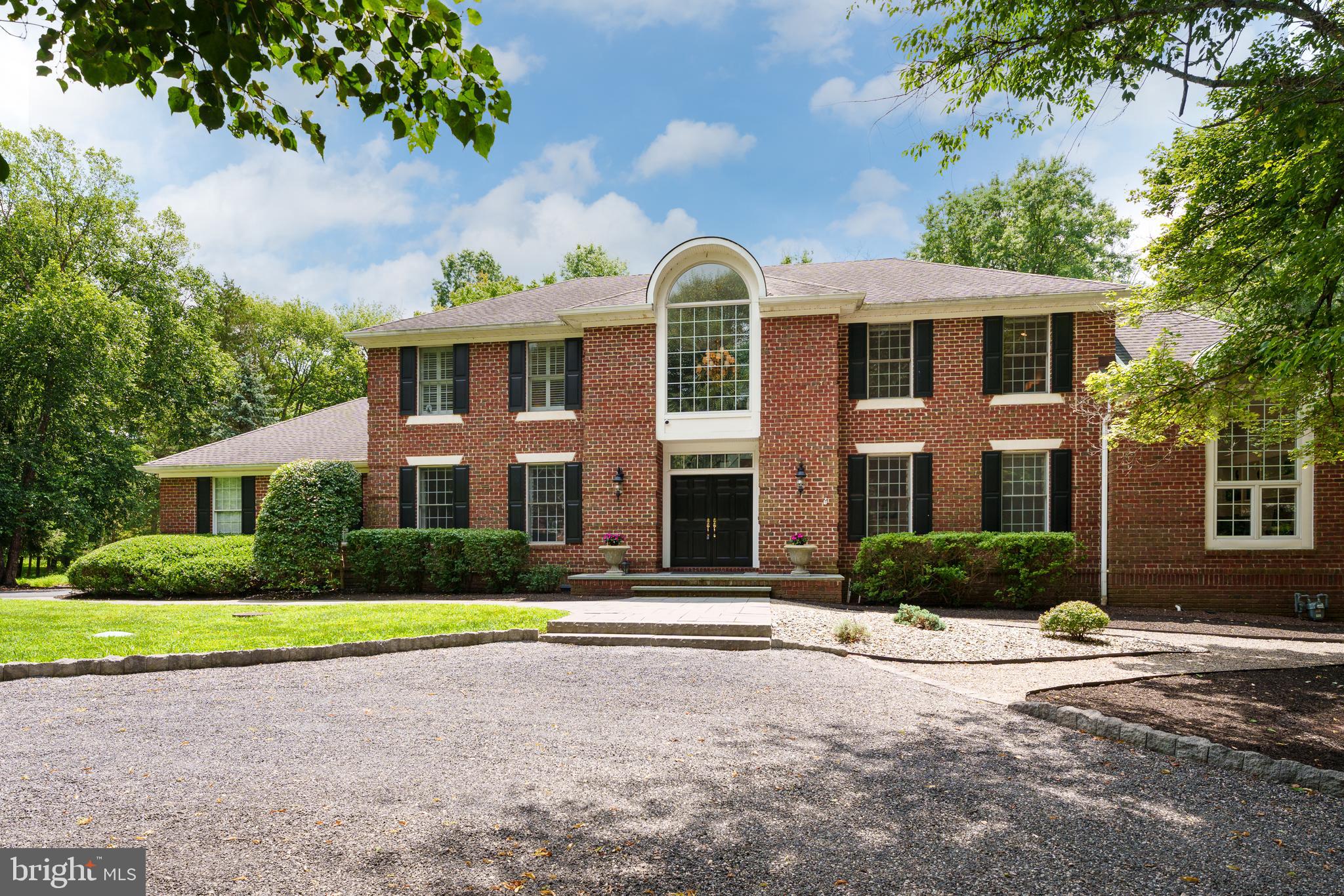 9 Deer Path Skillman, NJ 08558 - Photo 48 of 48 a front view of a house with garden