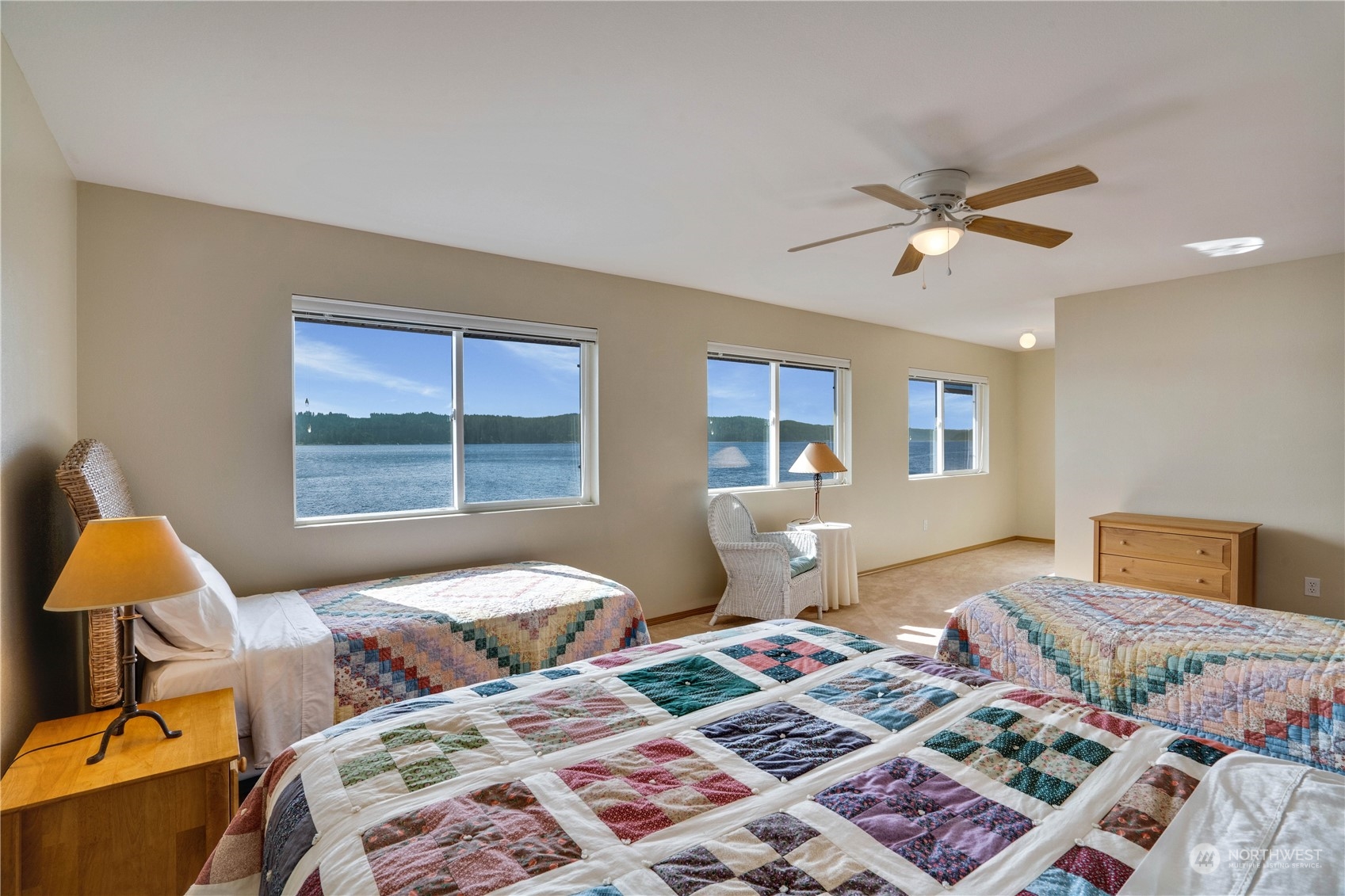 7381 Northeast North Shore Road Belfair, WA 98528 - Photo 30 of 38 a bedroom with a bed and wooden floor