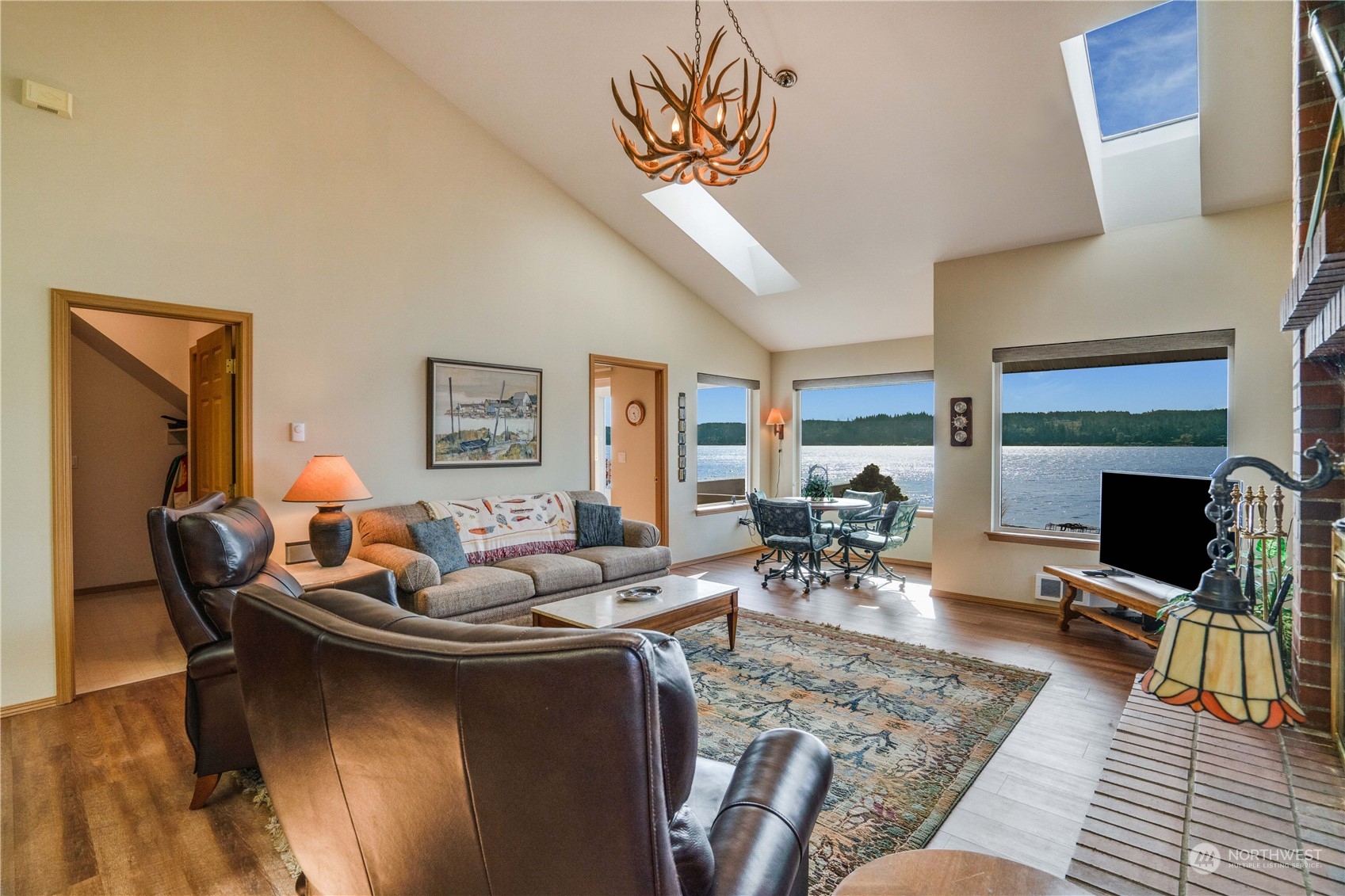 7381 Northeast North Shore Road Belfair, WA 98528 - Photo 7 of 38 a living room with furniture and a fireplace