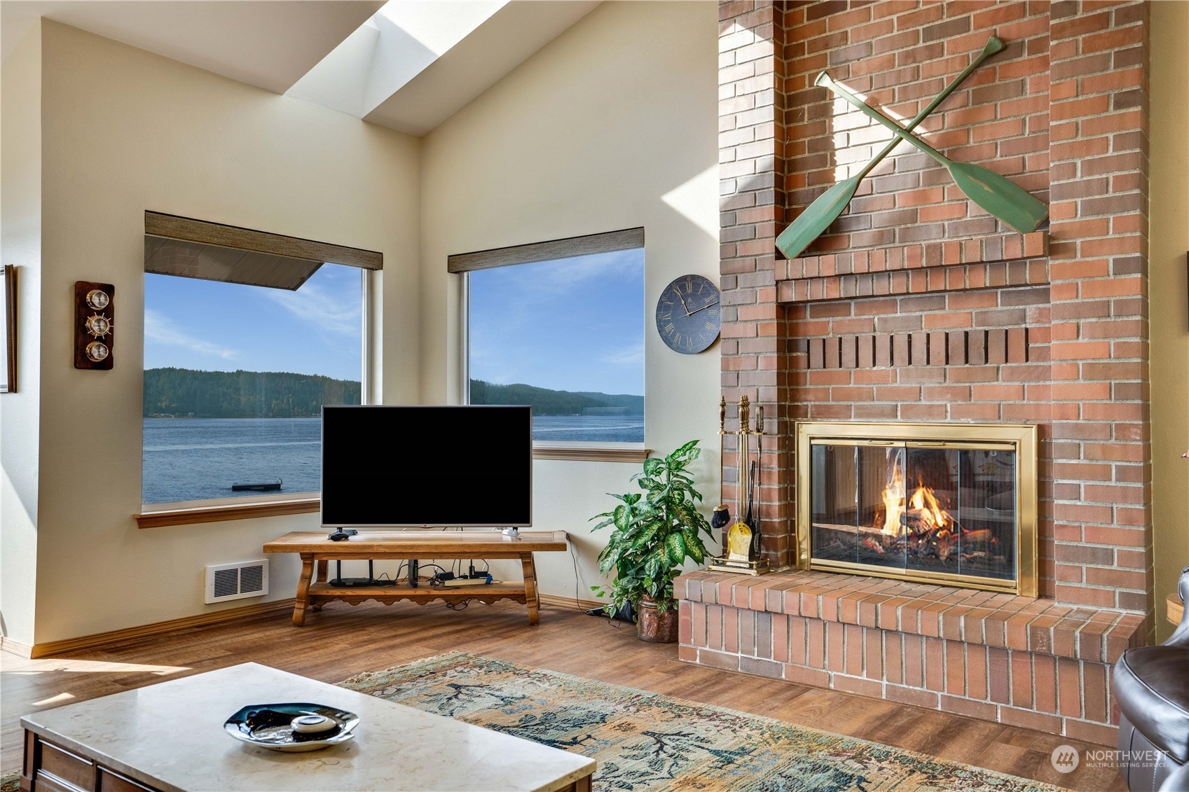 7381 Northeast North Shore Road Belfair, WA 98528 - Photo 8 of 38 a living room with furniture and a flat screen tv