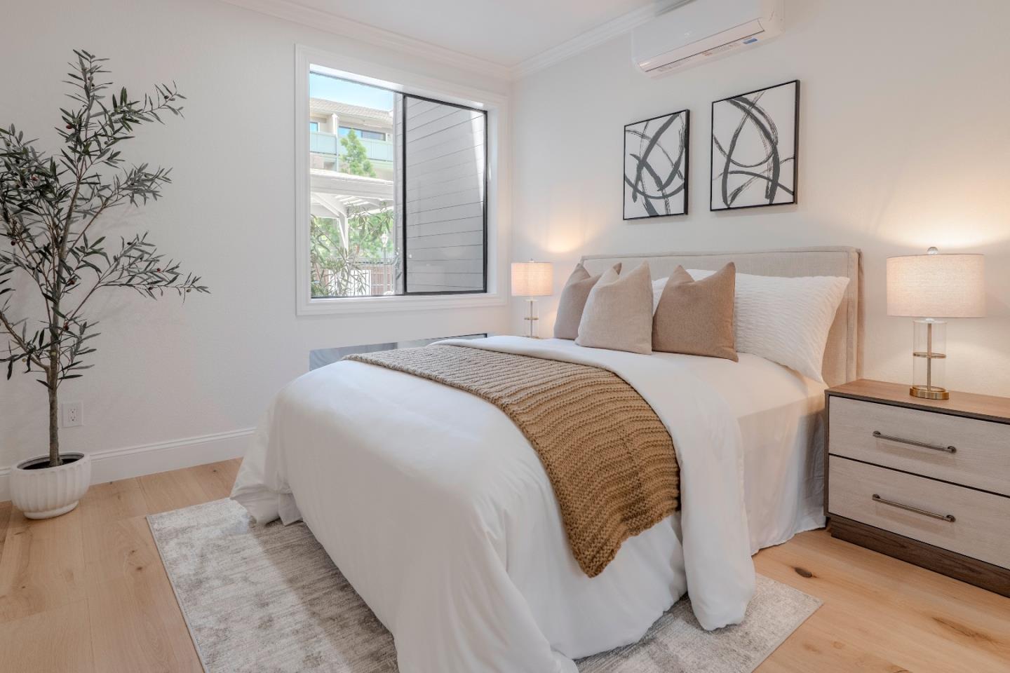 22330 Homestead Road, Unit 116 Cupertino, CA 95014 - Photo 22 of 30 a spacious bedroom with a bed and a window