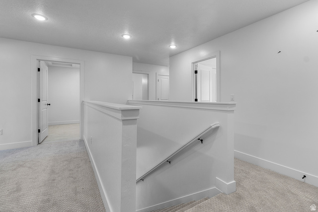 2816 West Aurora Avenue Mapleton, UT 84664 - Photo 13 of 20 Corridor with light colored carpet, an upstairs landing, and recessed lighting