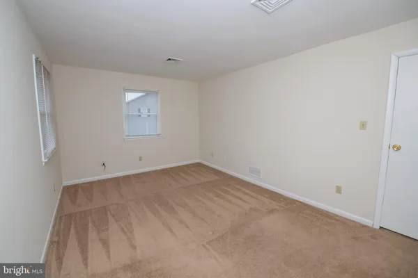 a view of a room that has a window in it