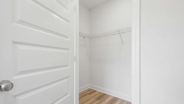 a view of an empty walk in closet
