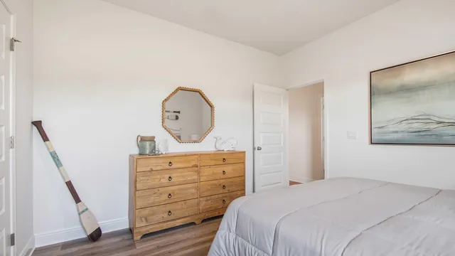 a bedroom with a baby bed and a dresser