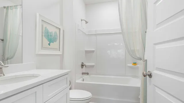 a bathroom with a sink a toilet and a bathtub
