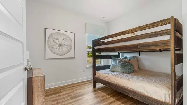 a bedroom with a bed and chair