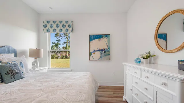 a bedroom with a bed and a table in it