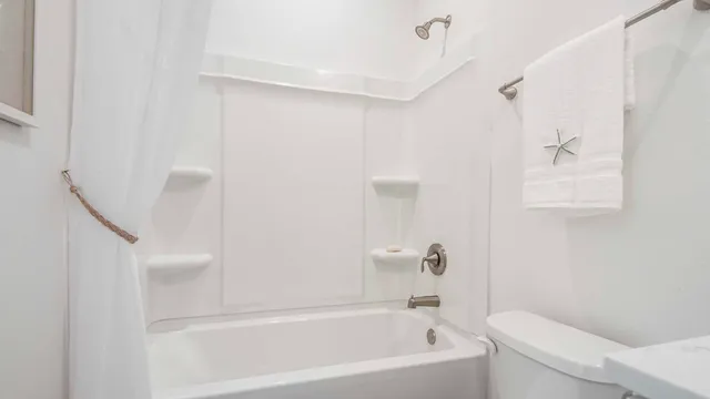 a bathroom with a bathtub and a shower