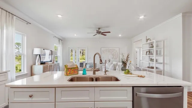 a kitchen with a sink stainless steel appliances and cabinets