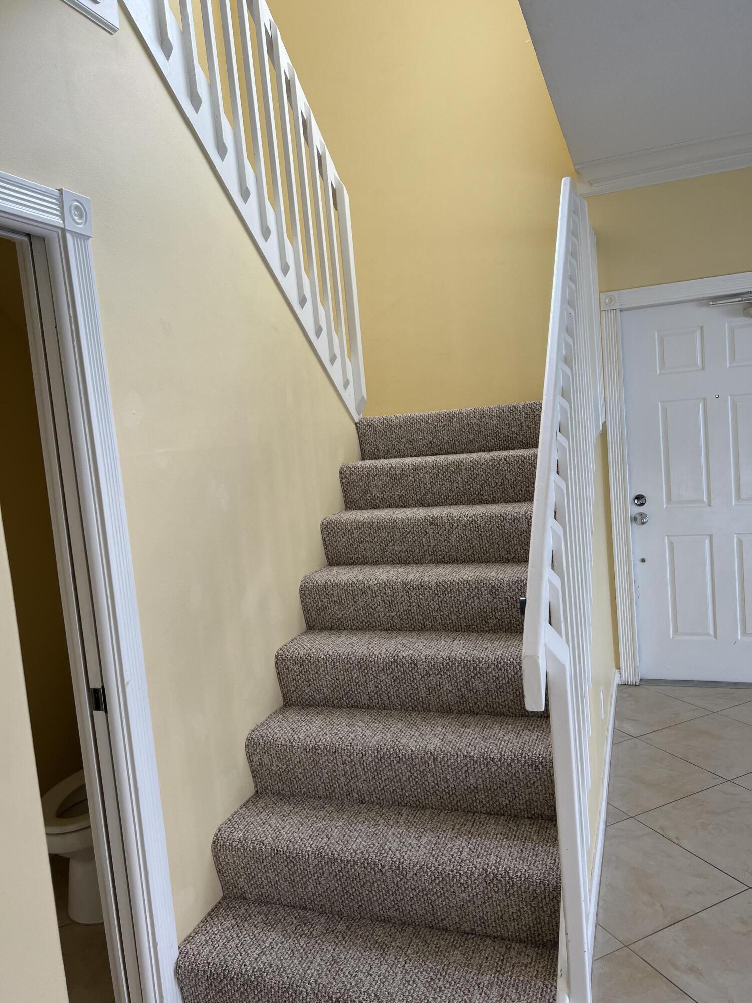 17 Oakleaf Court Tequesta, FL 33469 - Photo 53 of 81 STAIRCASE TO SECOND LEVEL