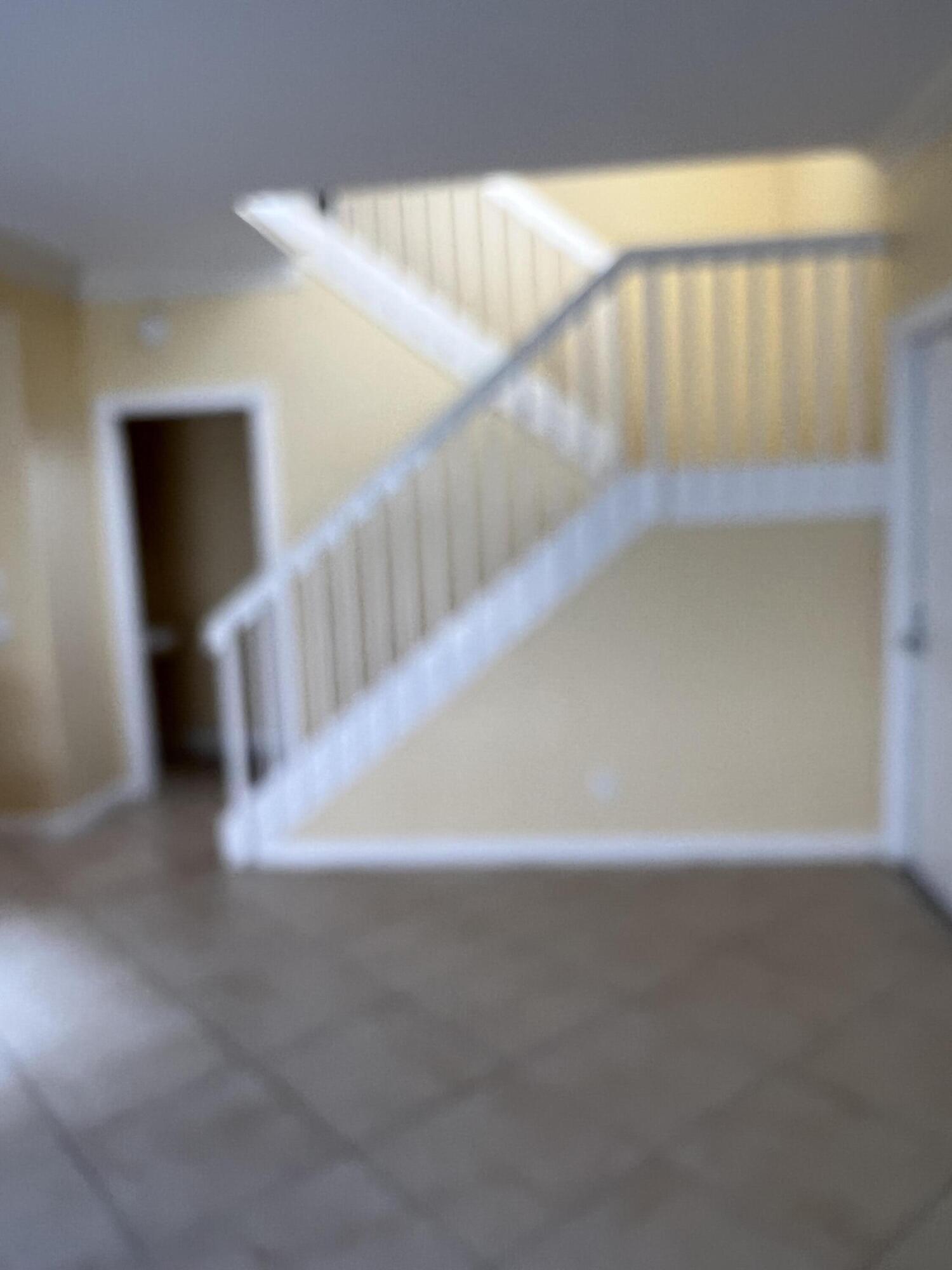 17 Oakleaf Court Tequesta, FL 33469 - Photo 54 of 81 STAIRCASE TO SECOND LEVEL
