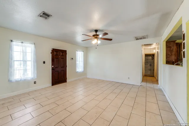 a view of an empty room with a window