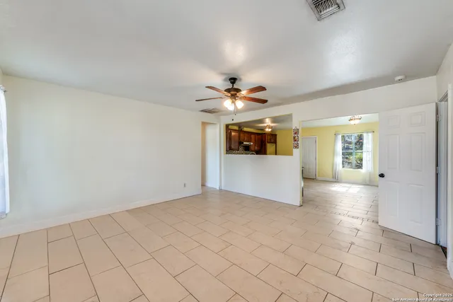 a view of a kitchen with a sink and a window
