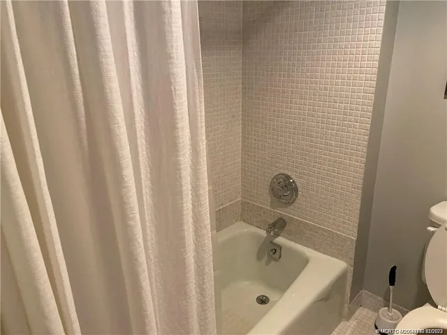 a bathroom with a tub and sink
