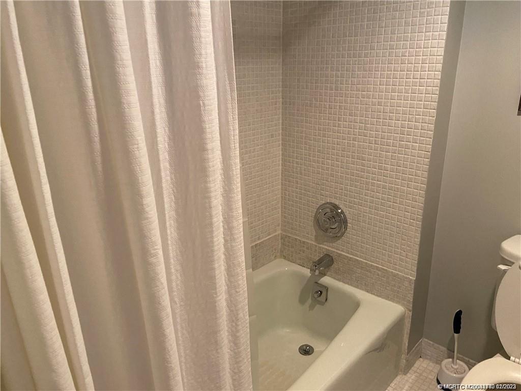 3901 Southeast St Lucie Boulevard, Unit D29 Stuart, FL 34997 - Photo 15 of 26 a bathroom with a tub and sink