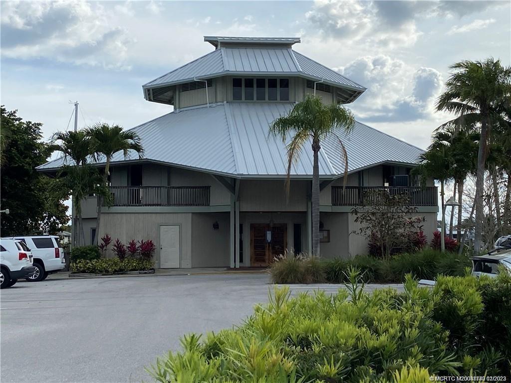 3901 Southeast St Lucie Boulevard, Unit D29 Stuart, FL 34997 - Photo 20 of 26 a front view of a house with a garden