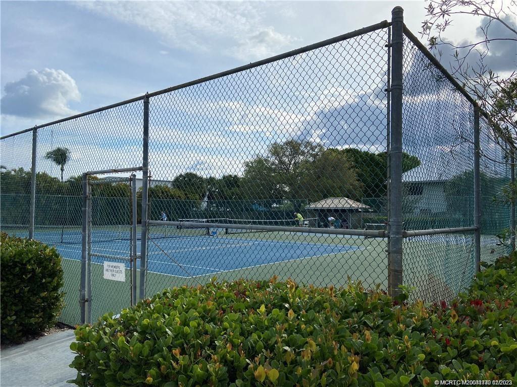 3901 Southeast St Lucie Boulevard, Unit D29 Stuart, FL 34997 - Photo 21 of 26 a view of a tennis court